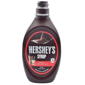 Image of chocolate flavor syrup inside a brown colour bottle.